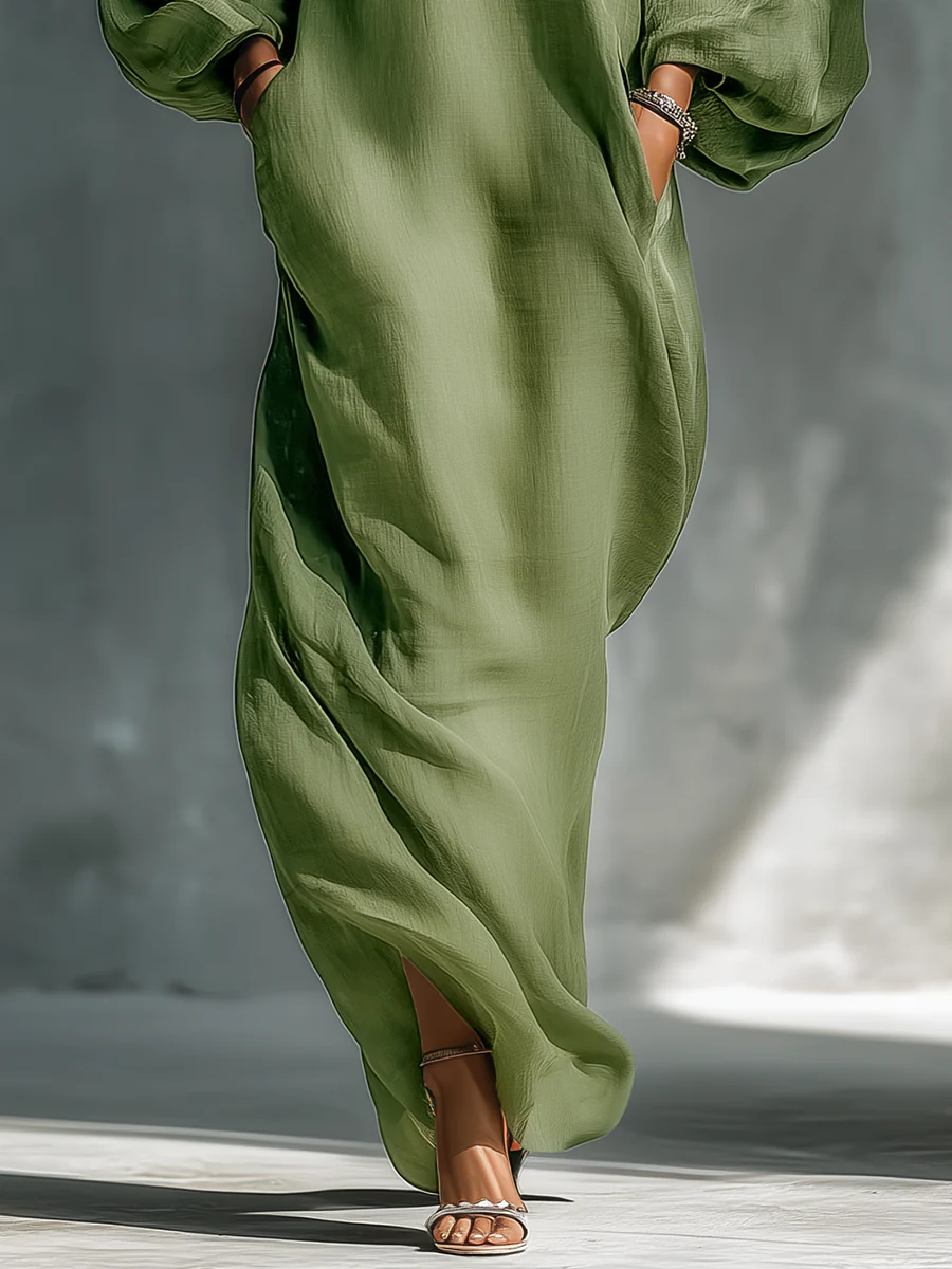 Selena | Vestido largo verde fluido con hombros descubiertos y mangas amplias