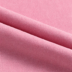 Cárdigan con capucha y botones en rosa, con vaqueros