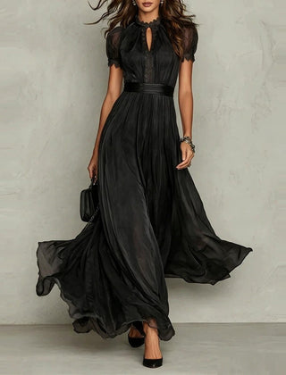 Vestido de invitada largo de gasa en negro, cuerpo entero con vuelo