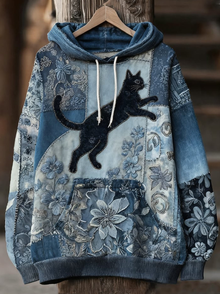 Sudadera vaquera con gato negro saltando