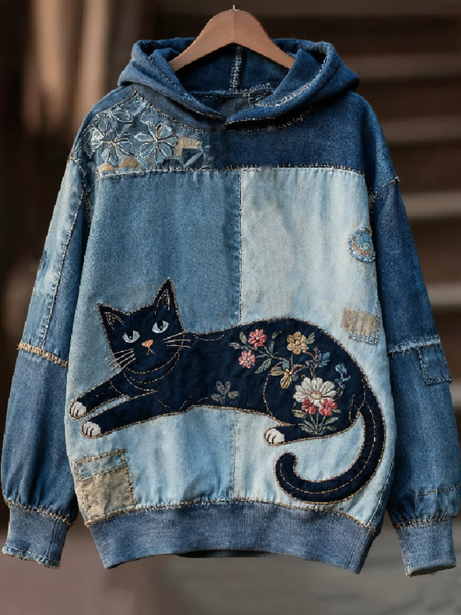 Sudadera vaquera con gato negro enroscado
