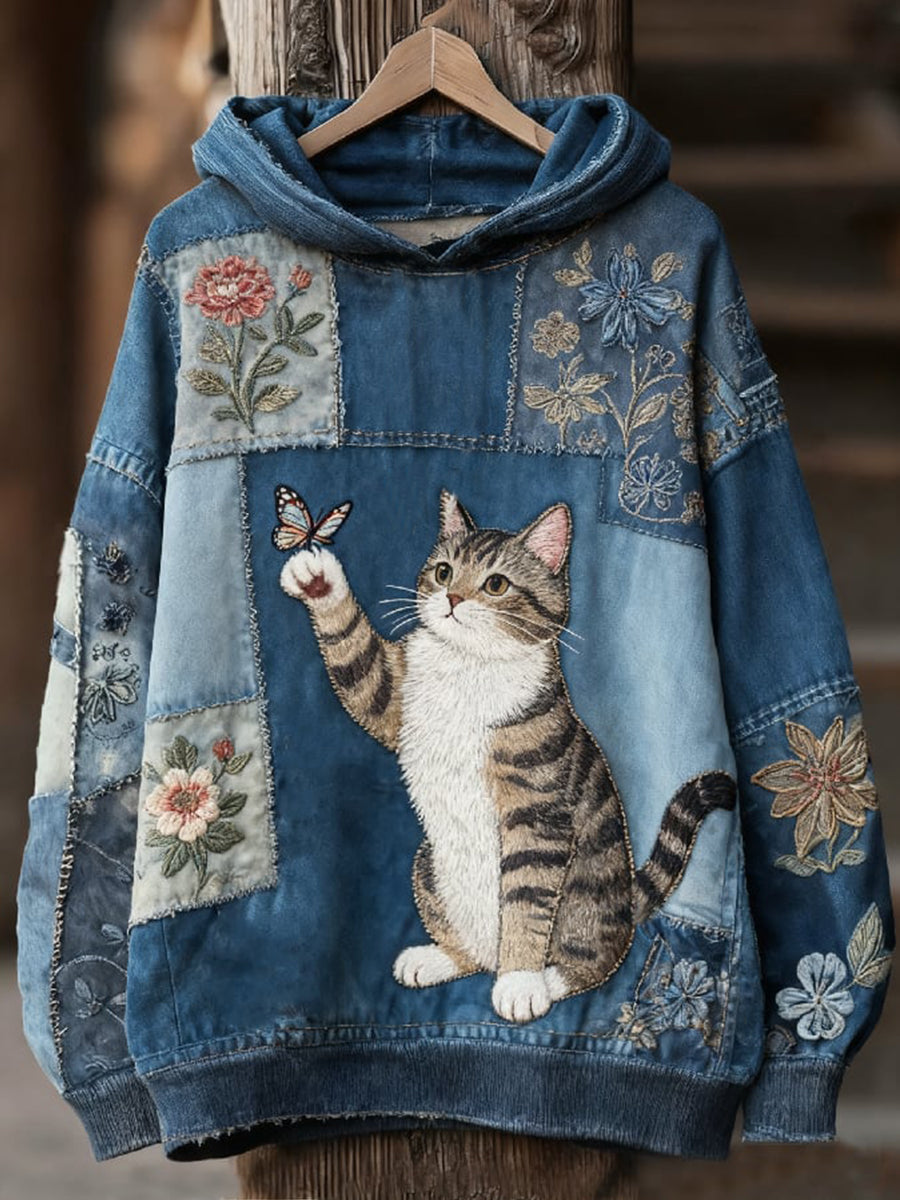 Sudadera vaquera con gato que saluda